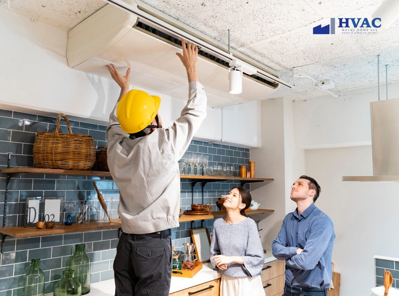 Essential guide to HVAC maintenance showing a technician servicing an air handler filter.